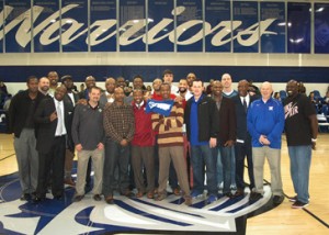 Members of Southern Wesleyan University’s top 30 basketball alumni took to midcourt at halftime of the Belmont Abbey game, where they were reunited with their coach, Charles Wimphrie third from right. They were honored by the fans Jan. 31 at Tysinger Gymnasium on the Central campus.