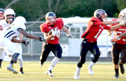 Brandy Karr/For The Courier Liberty senior Eddy Mathis looks for running room during the Red Devils’ overtime loss against Crescent on Friday night. 