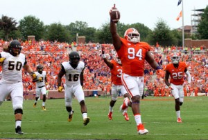 Rex Brown/Courtesy The Journal Clemson senior defensive tackle Carlos Watkins raises the ball in the air as he reaches the end zone on an interception return for a touchdown Saturday against Appalachian State.