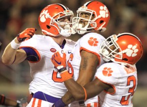 Rex Brown/Courtesy The Journal From left, Clemson’s Stanton Seckinger, Jordan Leggett and Ray-Ray McCloud celebrate after Leggett scored a touchdown during the Tigers’ 20-17 win at Louisville last Thursday.