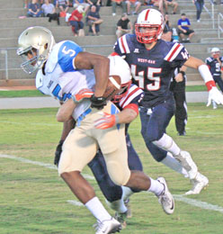 Rocky Nimmons/Courier Daniel’s Dante Gilliard fights for yardage during the Lions’ 42-0 road win over West-Oak on Friday night.