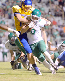 Tommy McGaha/Courier Easley’s Will Drawdy, seen here trying to shrug off a Wren tackler during their game earlier this month, scored a game-tying touchdown on a 72-yard pass at Laurens on Friday night, but the Raiders pulled away for a 27-14 win.