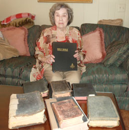 Mary Ann Ward displays her family Bibles.