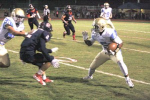 Rocky Nimmons/Courier Daniel senior Dante Gilliard tries to avoid a Belton-Honea Path defender after a catch during the Lions’ heartbreaking loss to the Bears on Friday night.