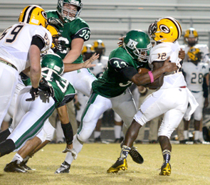 Kerry Gilstrap/Courier Easley’s Caleb Hill sacks Greenwood quarterback Roshun Jackson during the Green Wave’s 29-21 win over the Eagles Friday.