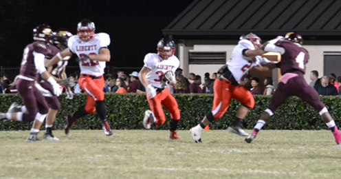 Brandy Karr/Photo Liberty’s Shaun Karr finds a hole against Woodruff on Friday night.