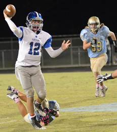 Tommy McGaha/seeyourphotohere.com Pickens quarterback Tanner Stegall throws a pass under pressure from the Daniel defense during their game Friday night in Central.