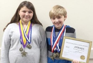 Skyler Hilley and Jasper Justus are pictured with the many awards they received at the 2015 American Talent Showcase. Not pictured are Keely Austin, Stephanie Matlis-Lee and Clara Jane Crocker.