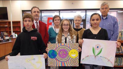 Liberty Middle School Peace Poster Contest winners, from left, are eighth-grader Justin Martin (second), sixth-grader Gracie Jackson (first) and eighth-grader Judith Martinez Lopez (third). Back row are Liberty principal Tim Mullis, art teacher Elaine Snell, Liberty Lions Club president Jean Thomas and chairman of the Peace Poster contest, Oscar Thorsland.