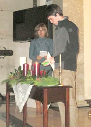 Loved ones light a candle of remembrance during the Christmas memorial service held at the Chapel of Reflection Mausoleum at Robinson Memorial Gardens.